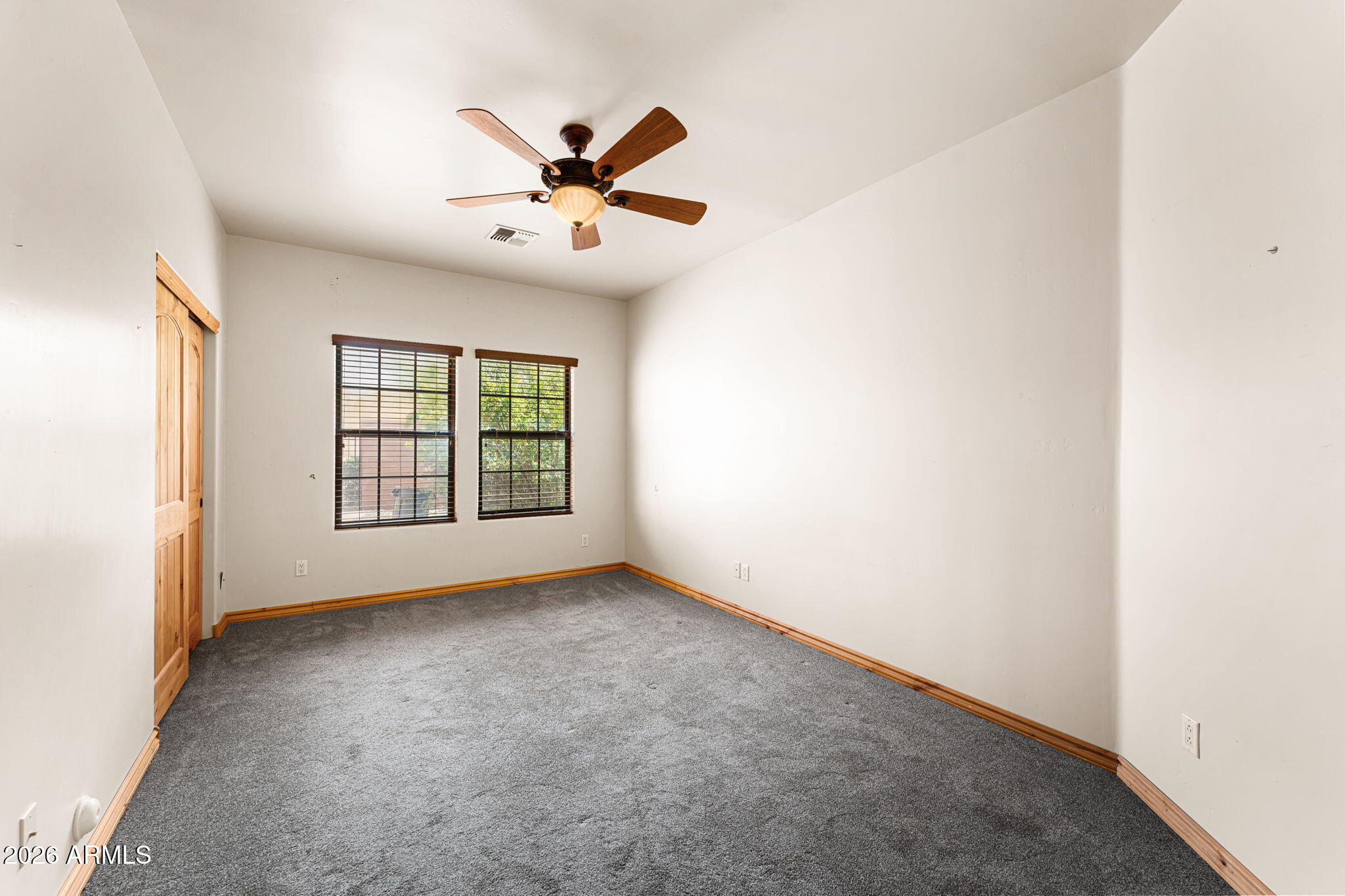 6646 East Lone Mountain Road Cave Creek, AZ 85331 - Photo 22 of 37 an empty room with windows and fan