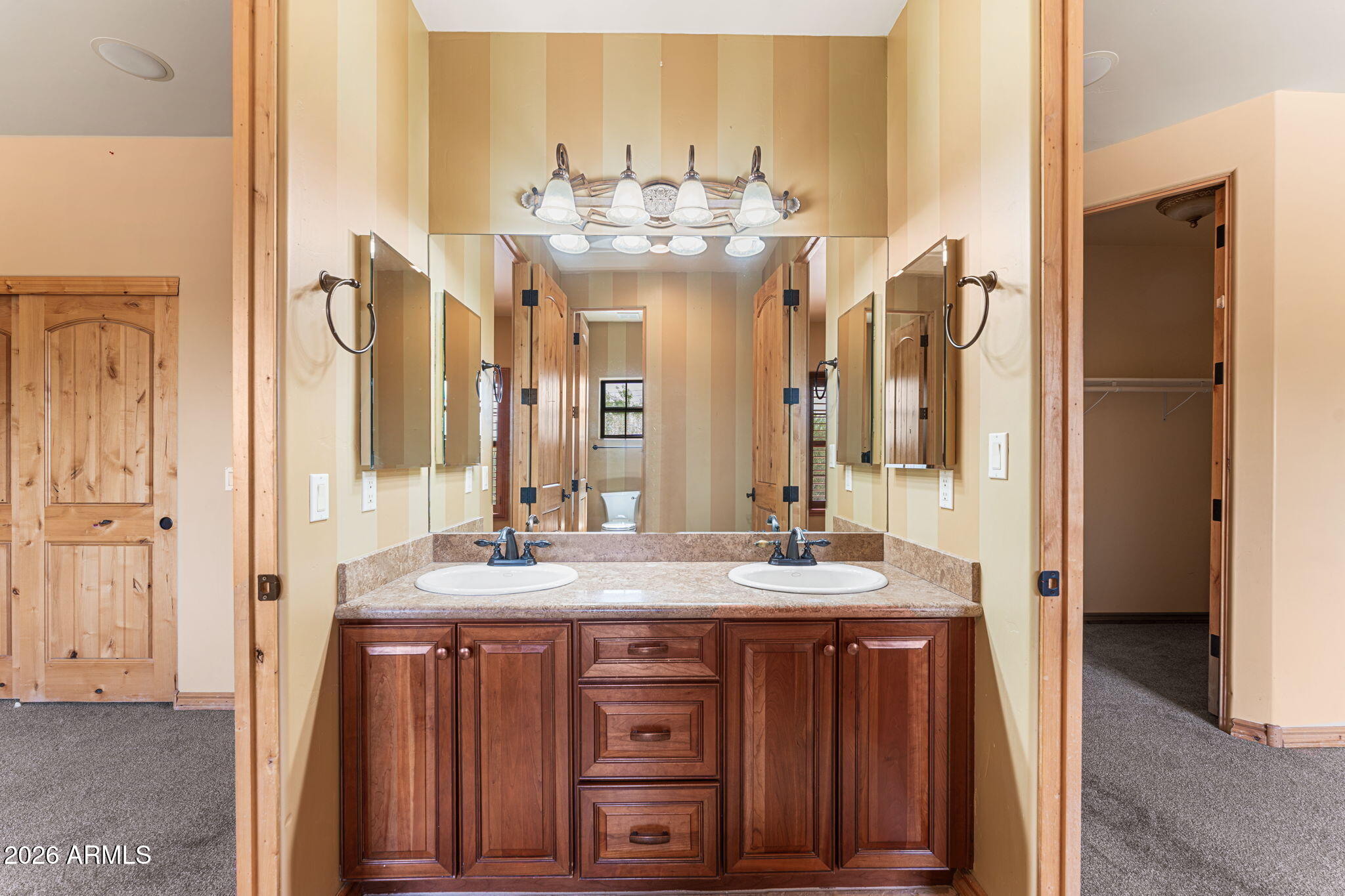 6646 East Lone Mountain Road Cave Creek, AZ 85331 - Photo 24 of 37 a bathroom with a double vanity sink and a mirror