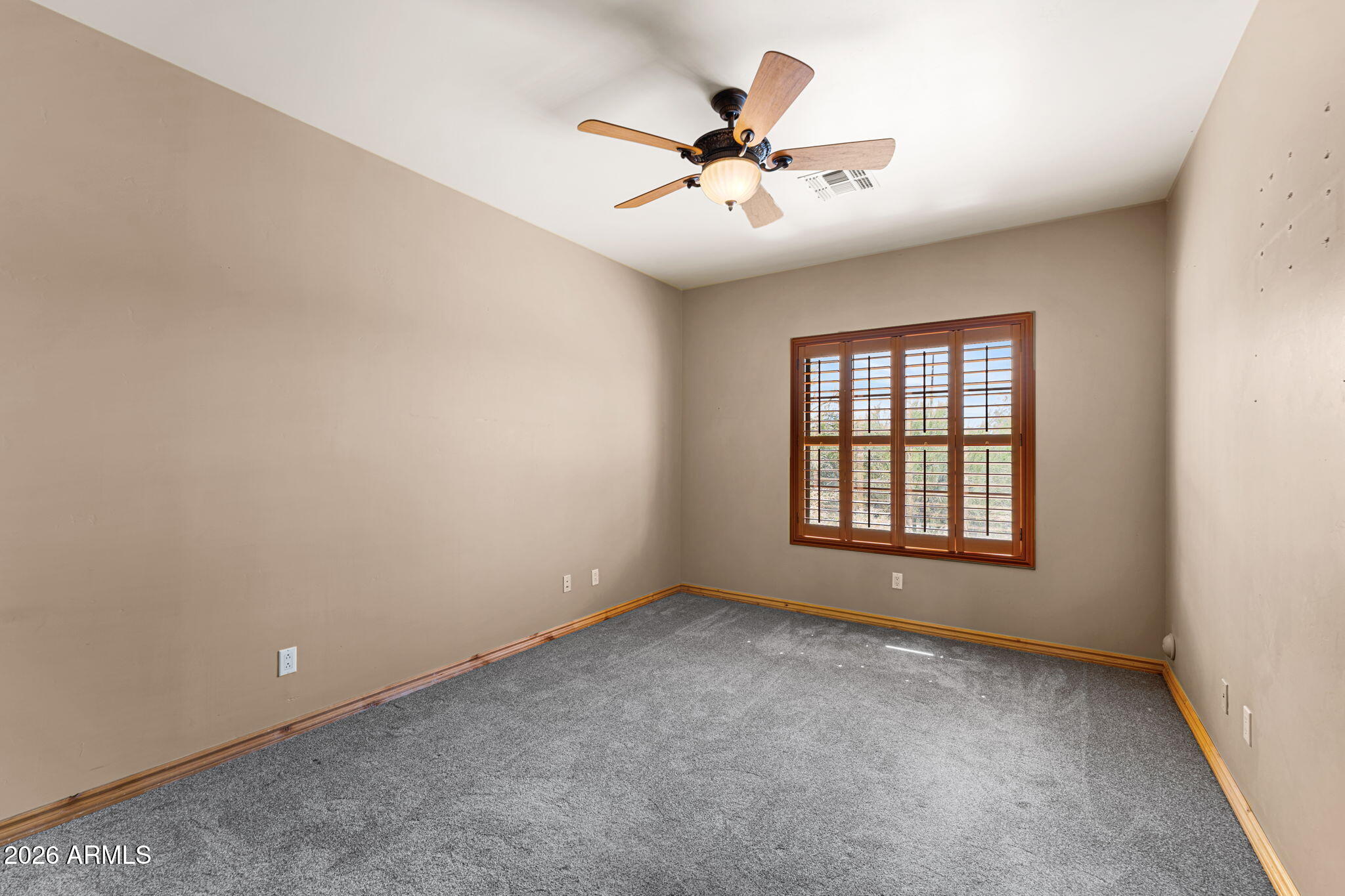 6646 East Lone Mountain Road Cave Creek, AZ 85331 - Photo 25 of 37 wooden floor in an empty room with a window