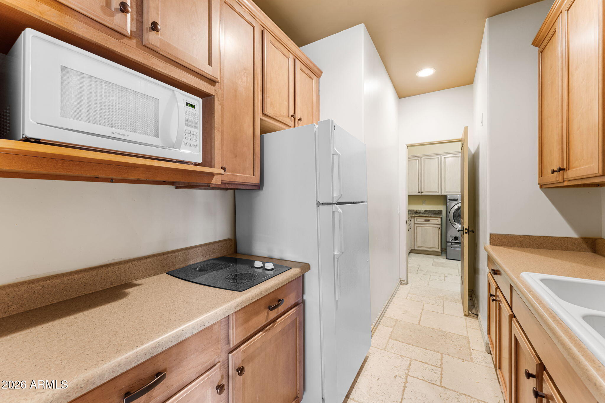 6646 East Lone Mountain Road Cave Creek, AZ 85331 - Photo 31 of 37 a kitchen with a refrigerator and a stove top oven
