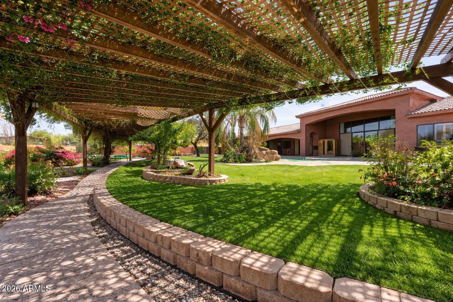 6646 East Lone Mountain Road Cave Creek, AZ 85331 - Photo 35 of 37 a view of a house with a yard