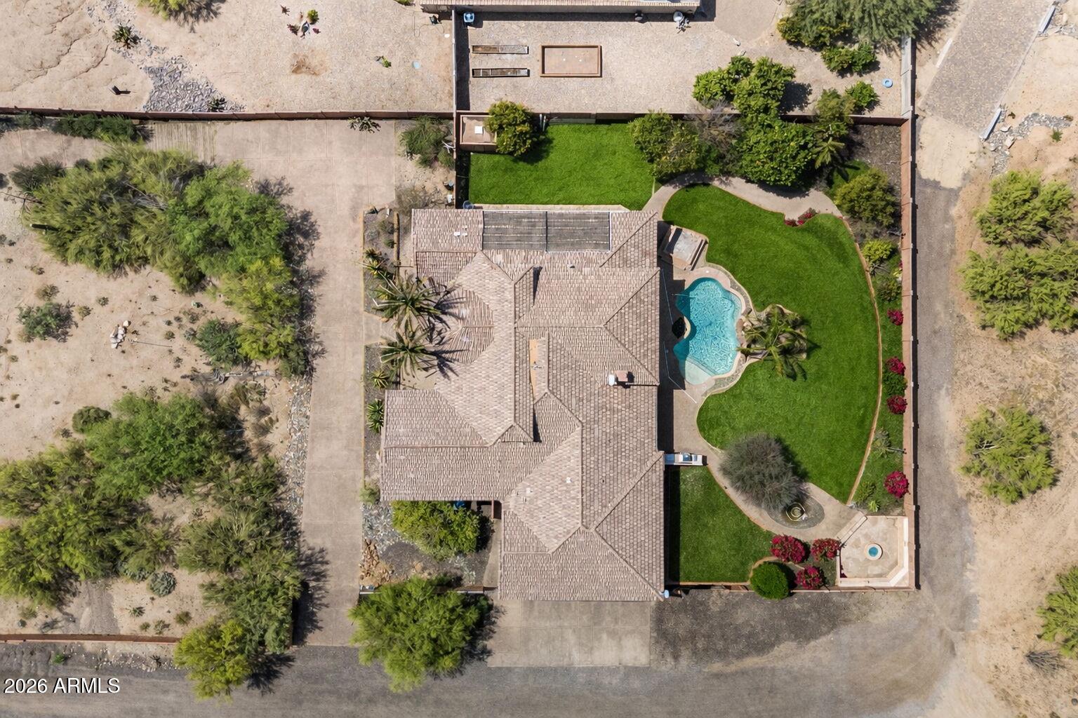 6646 East Lone Mountain Road Cave Creek, AZ 85331 - Photo 37 of 37 an aerial view of a house with a garden and outdoor space