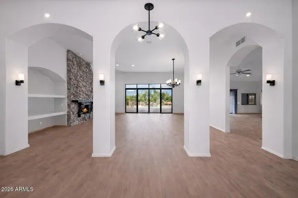 a bedroom with a large bed and flat screen tv