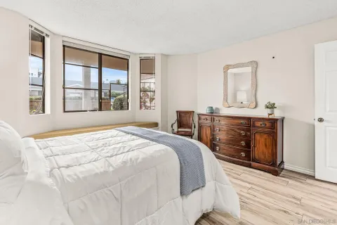 a bedroom with a bed and a fireplace