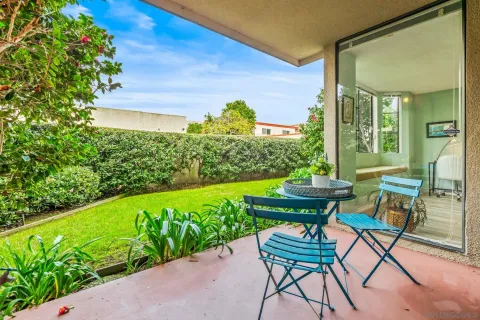 a view of a chairs and table in a garden