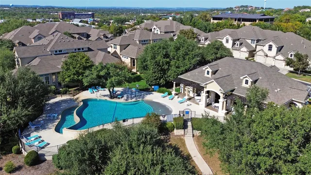 an aerial view of a house with a garden