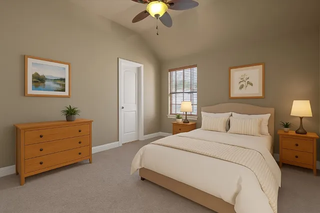 a spacious bedroom with a bed and a chandelier