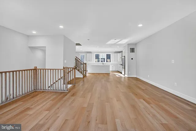 a view of a living room with wooden floor