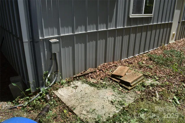 a view of a yard with large trees