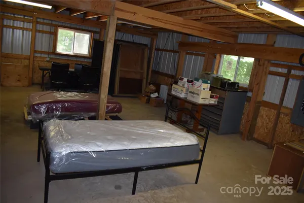 a store room with lots of furniture and clutter
