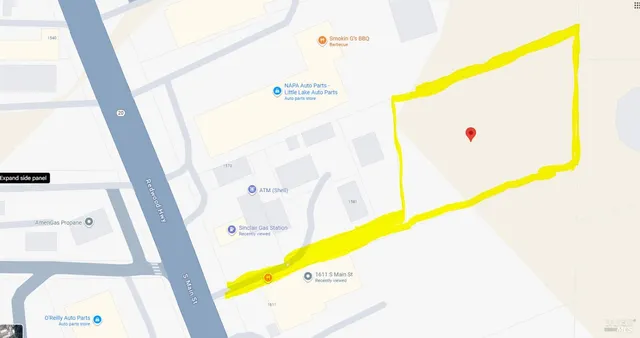 a view of a swimming pool with seating area