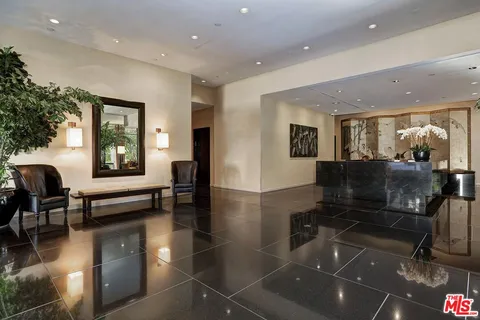 a lobby with furniture and windows