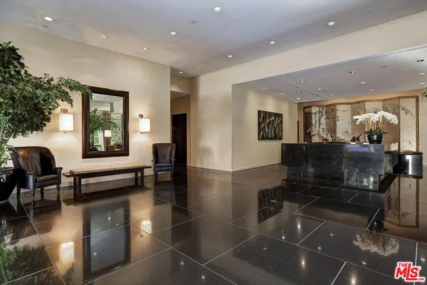 a lobby with furniture and windows