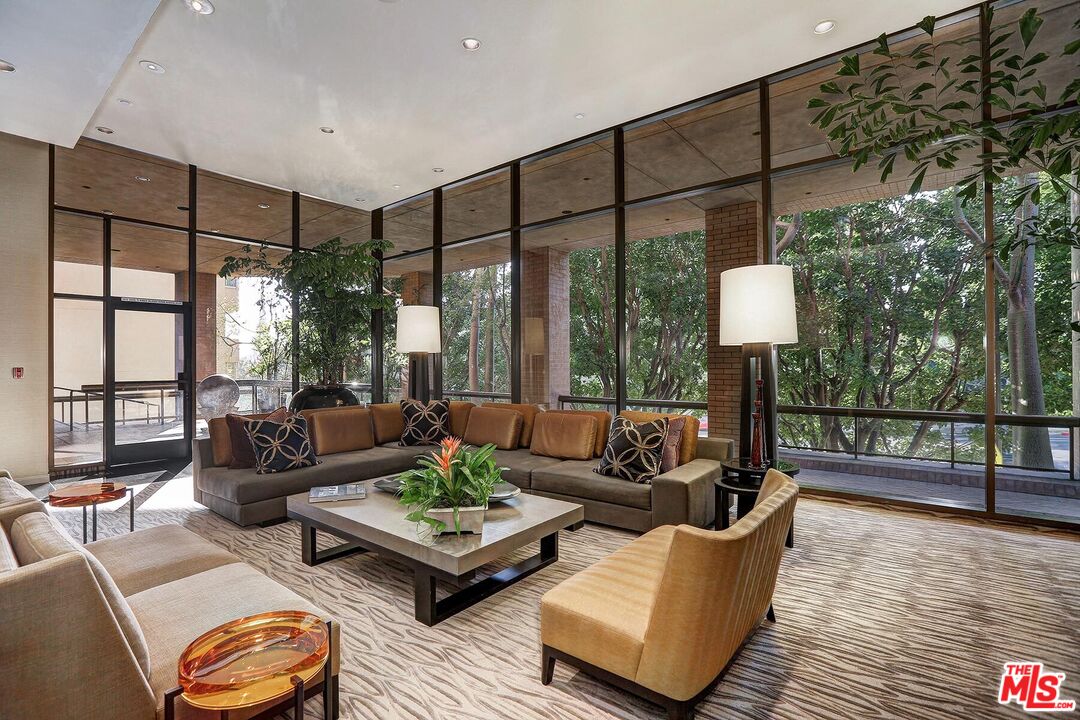 10430 Wilshire Boulevard, Unit 803 Los Angeles, CA 90024 - Photo 20 of 23 a living room with furniture and a large window