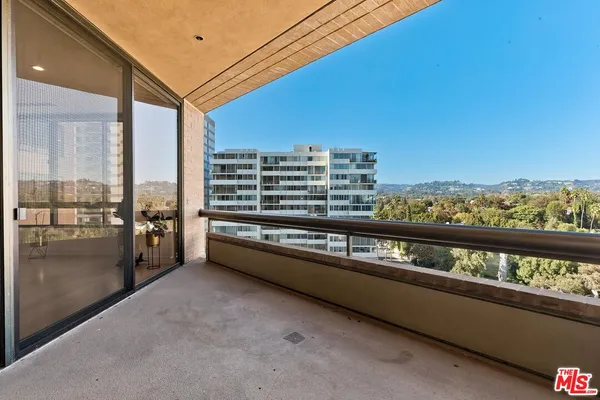 a view of a balcony with city view