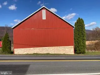 a view of a house with a small yard