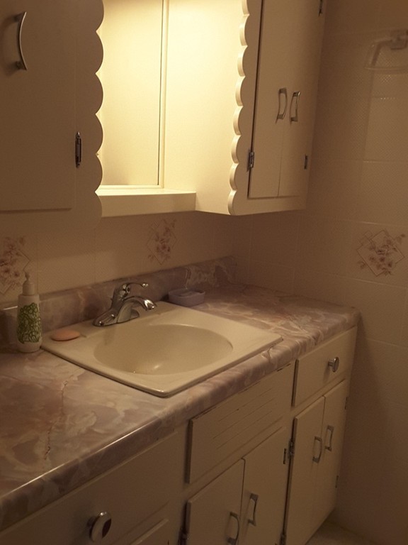 82 Monson Turnpike Road Ware, MA 01082 - Photo 13 of 29 a bathroom with a sink and a window