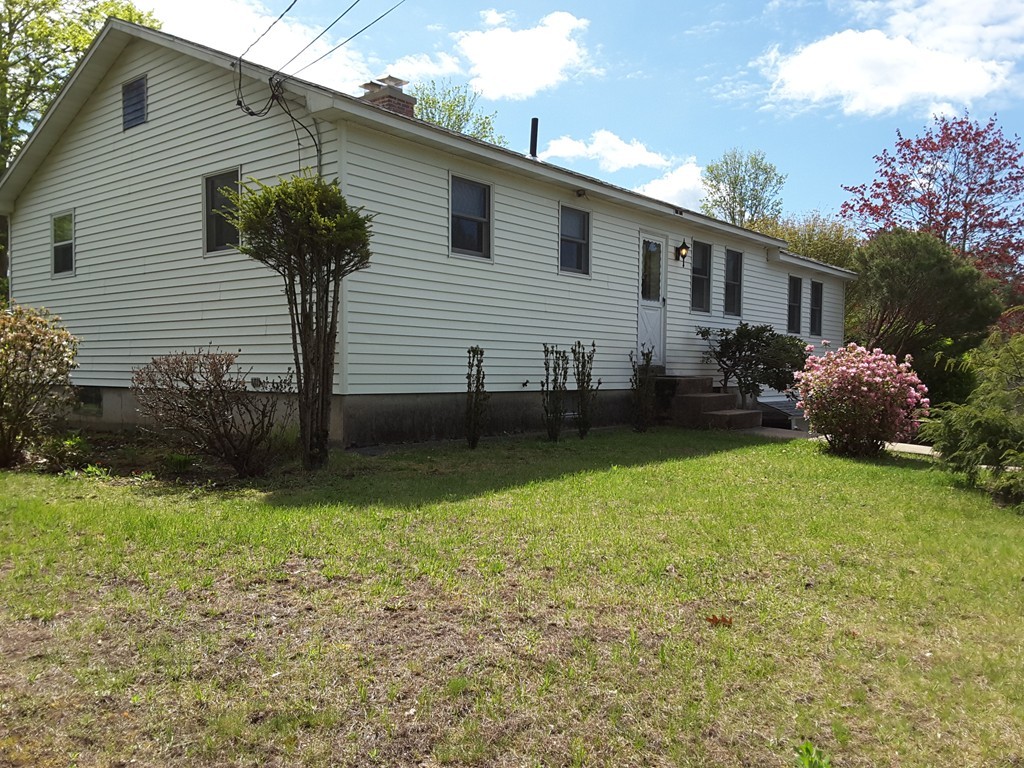 82 Monson Turnpike Road Ware, MA 01082 - Photo 4 of 29 a front view of house with garden