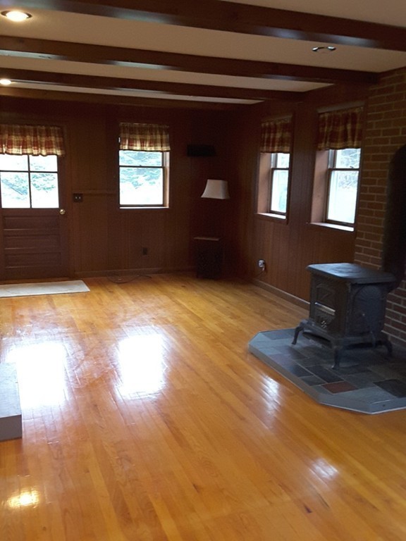 82 Monson Turnpike Road Ware, MA 01082 - Photo 8 of 29 a view of empty room with windows