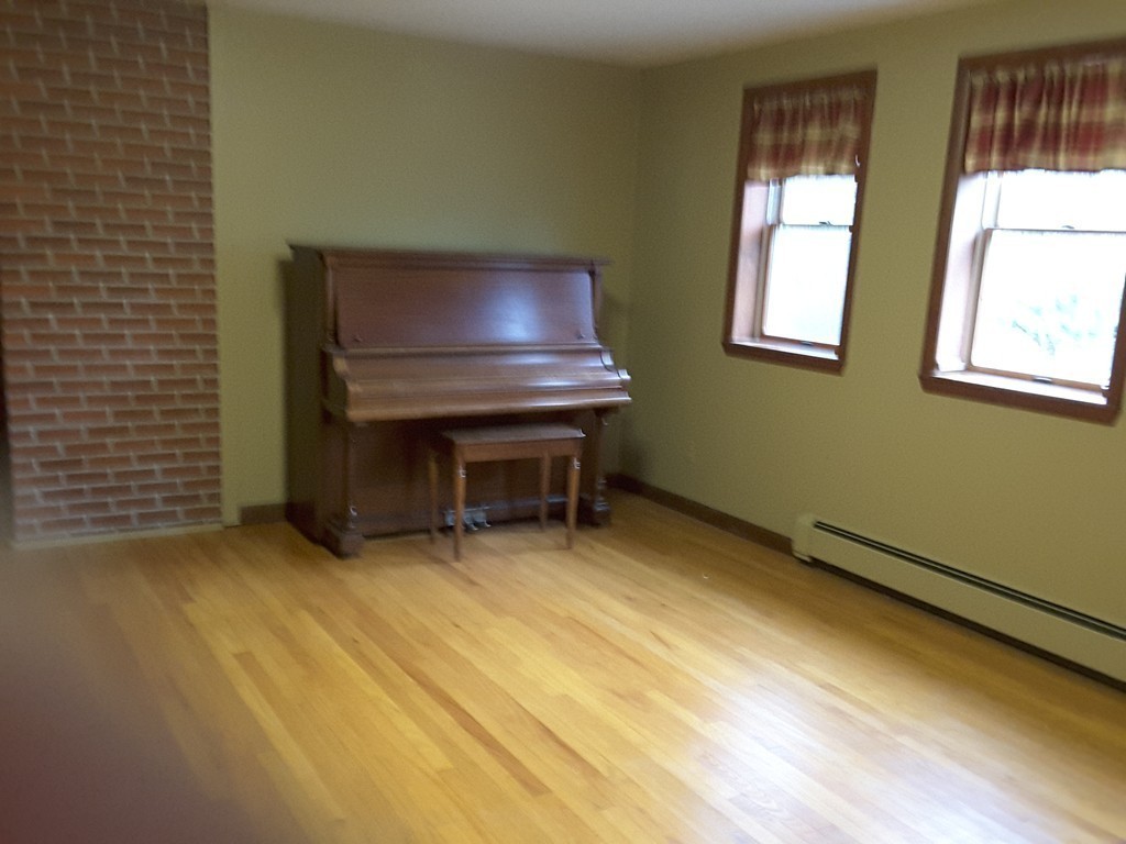 82 Monson Turnpike Road Ware, MA 01082 - Photo 10 of 29 a room with furniture and a window