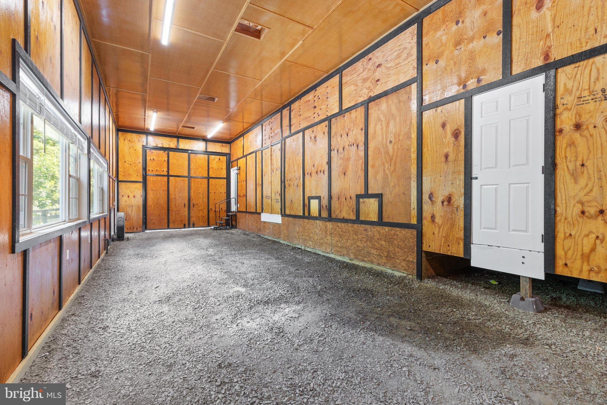 0 Flat Iron Road Montross, VA 22520 - Photo 20 of 116 Spacious interior with rustic wooden walls.