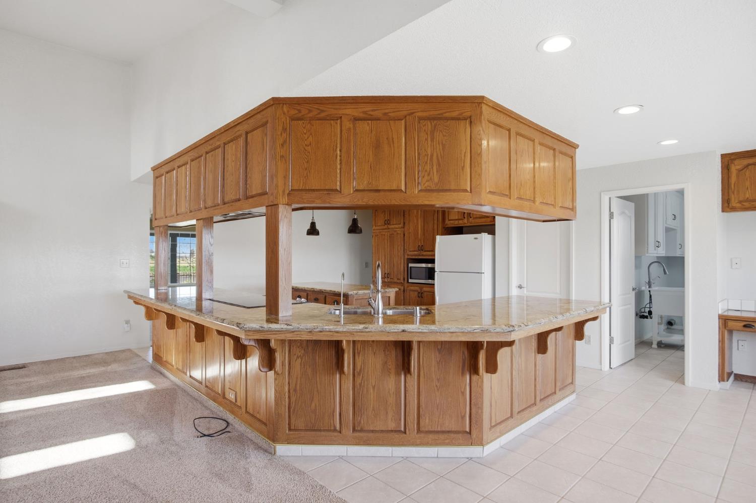 16166 Lawrence Road Escalon, CA 95320 - Photo 14 of 56 a kitchen with stainless steel appliances granite countertop a sink and cabinets