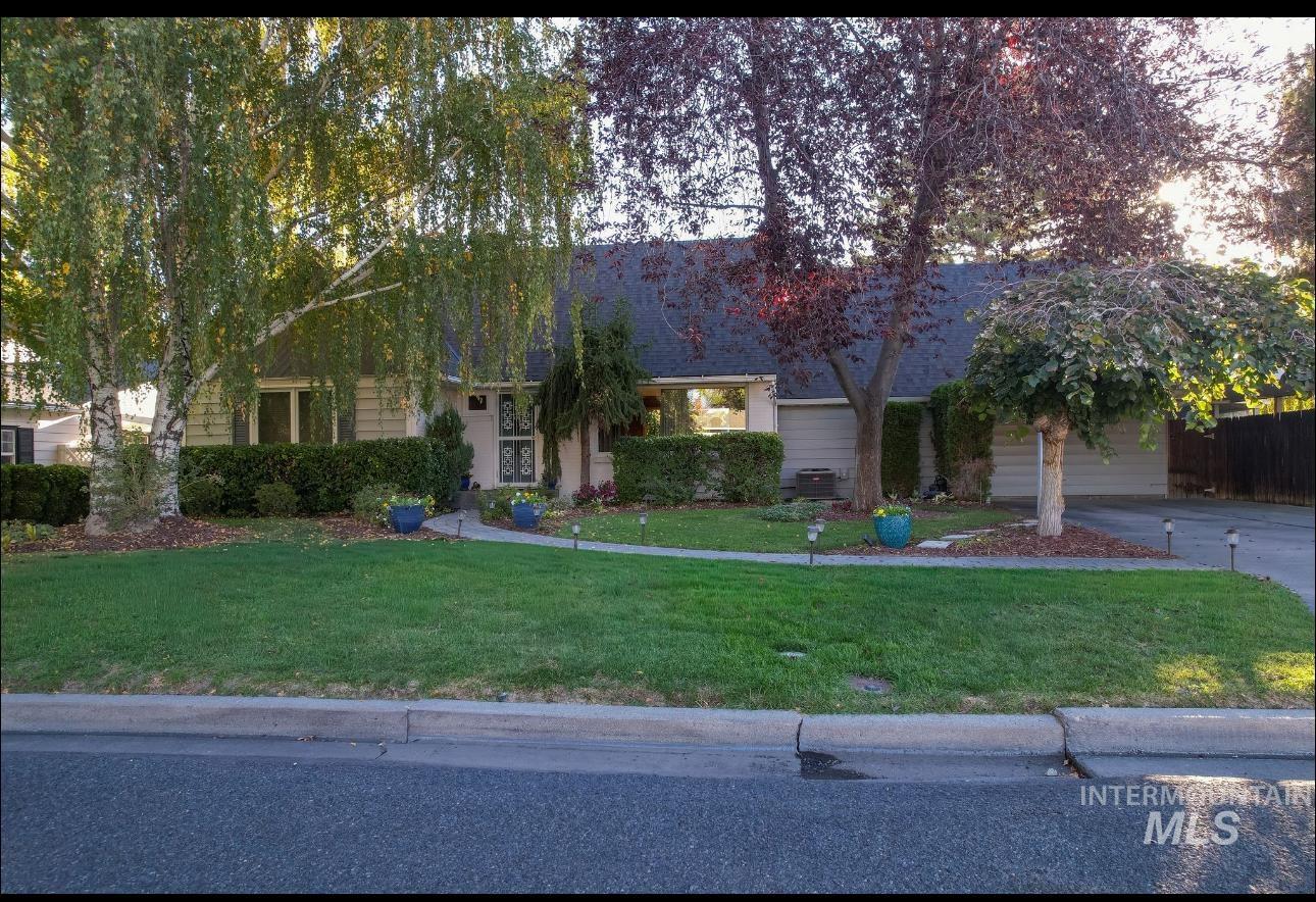 532 Pierce Street Twin Falls, ID 83301 - Photo 1 of 1 Obstructed view of property featuring a front lawn and driveway