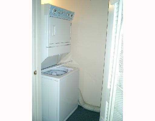 2901 Fiore Way, Unit 103 Delray Beach, FL 33445 - Photo 19 of 29 a utility room with dryer and washer