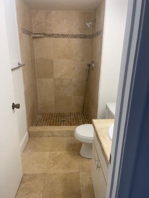 2901 Fiore Way, Unit 103 Delray Beach, FL 33445 - Photo 8 of 29 a bathroom with a toilet and shower