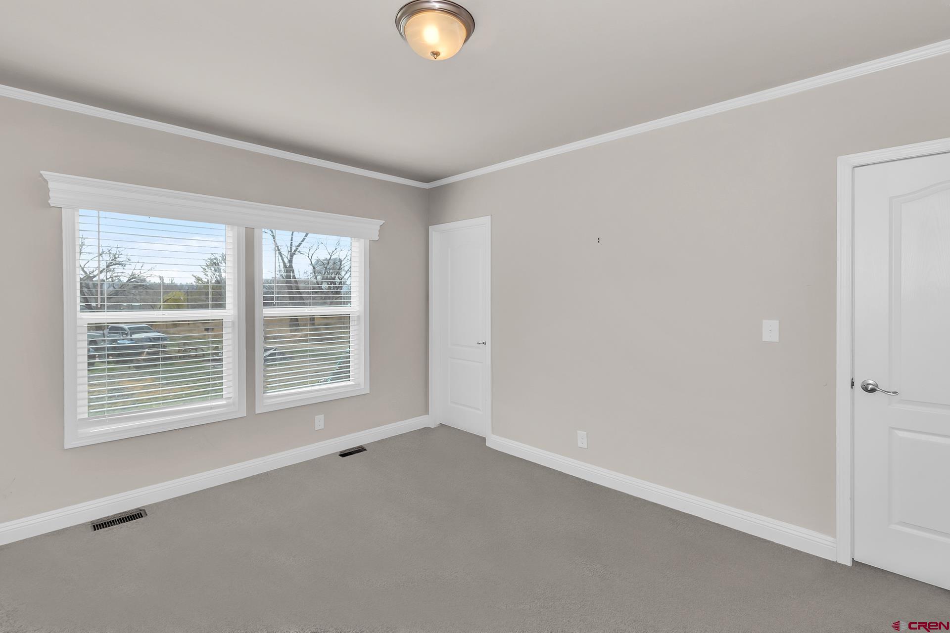 21357 Knight Road Austin, CO 81410 - Photo 22 of 35 a view of an empty room with a window
