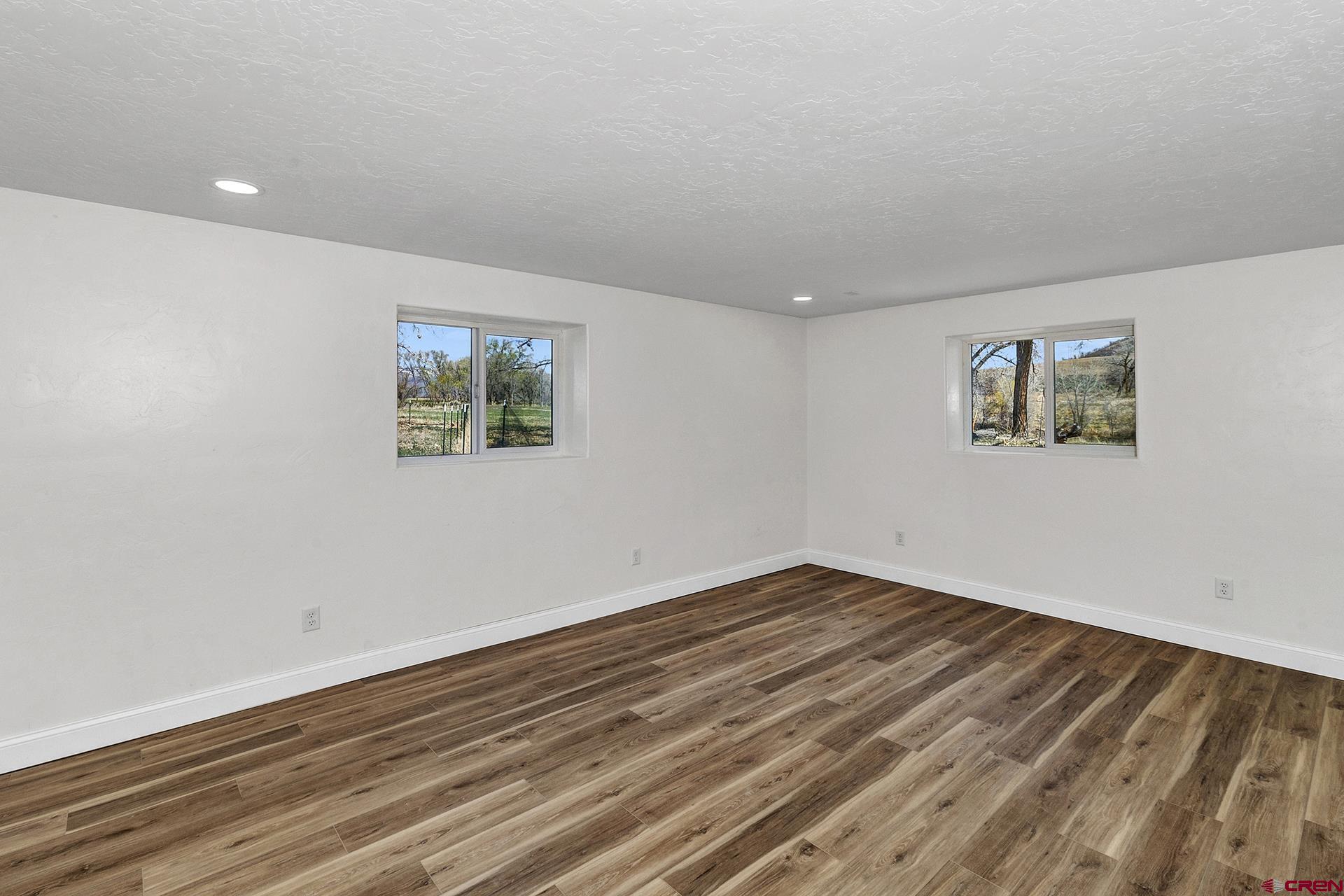21357 Knight Road Austin, CO 81410 - Photo 28 of 35 a view of empty room with wooden floor