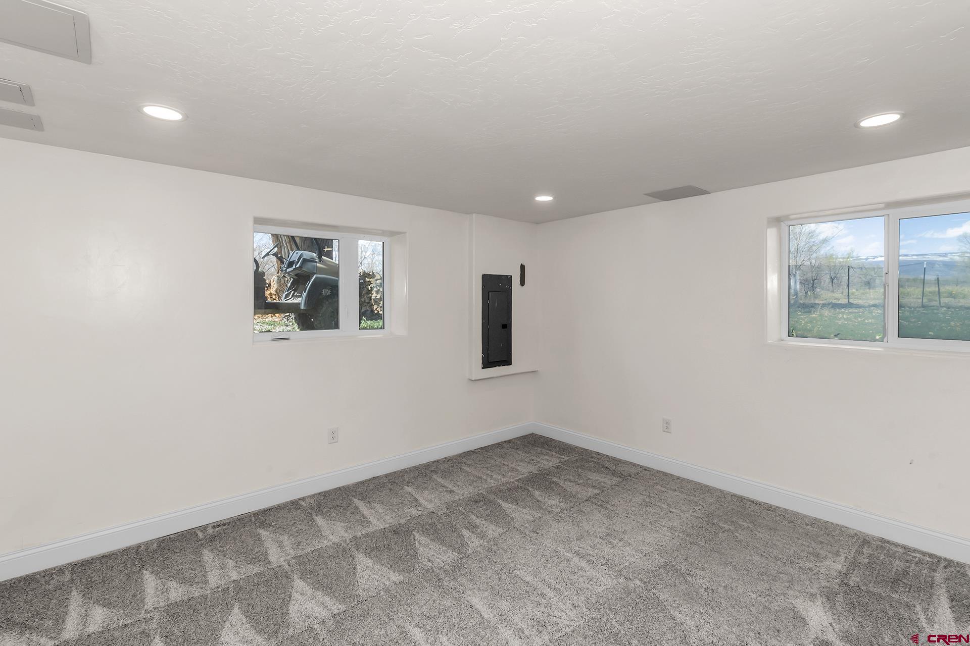 21357 Knight Road Austin, CO 81410 - Photo 30 of 35 an empty room with windows