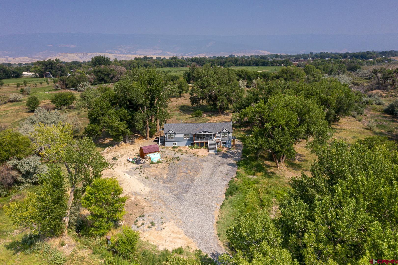21357 Knight Road Austin, CO 81410 - Photo 4 of 35 a view of a city with lush green forest