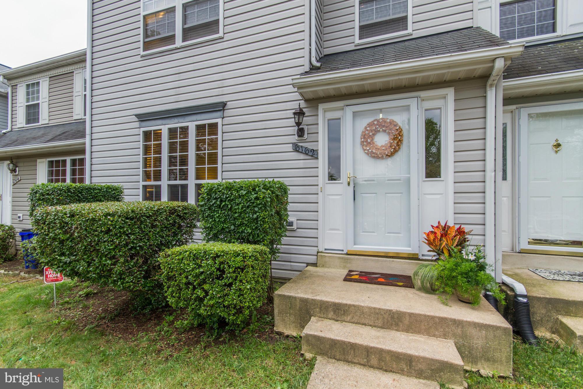 6162 Good Hunters Ride Columbia, MD 21045 - Photo 2 of 30 a front view of a house with plants
