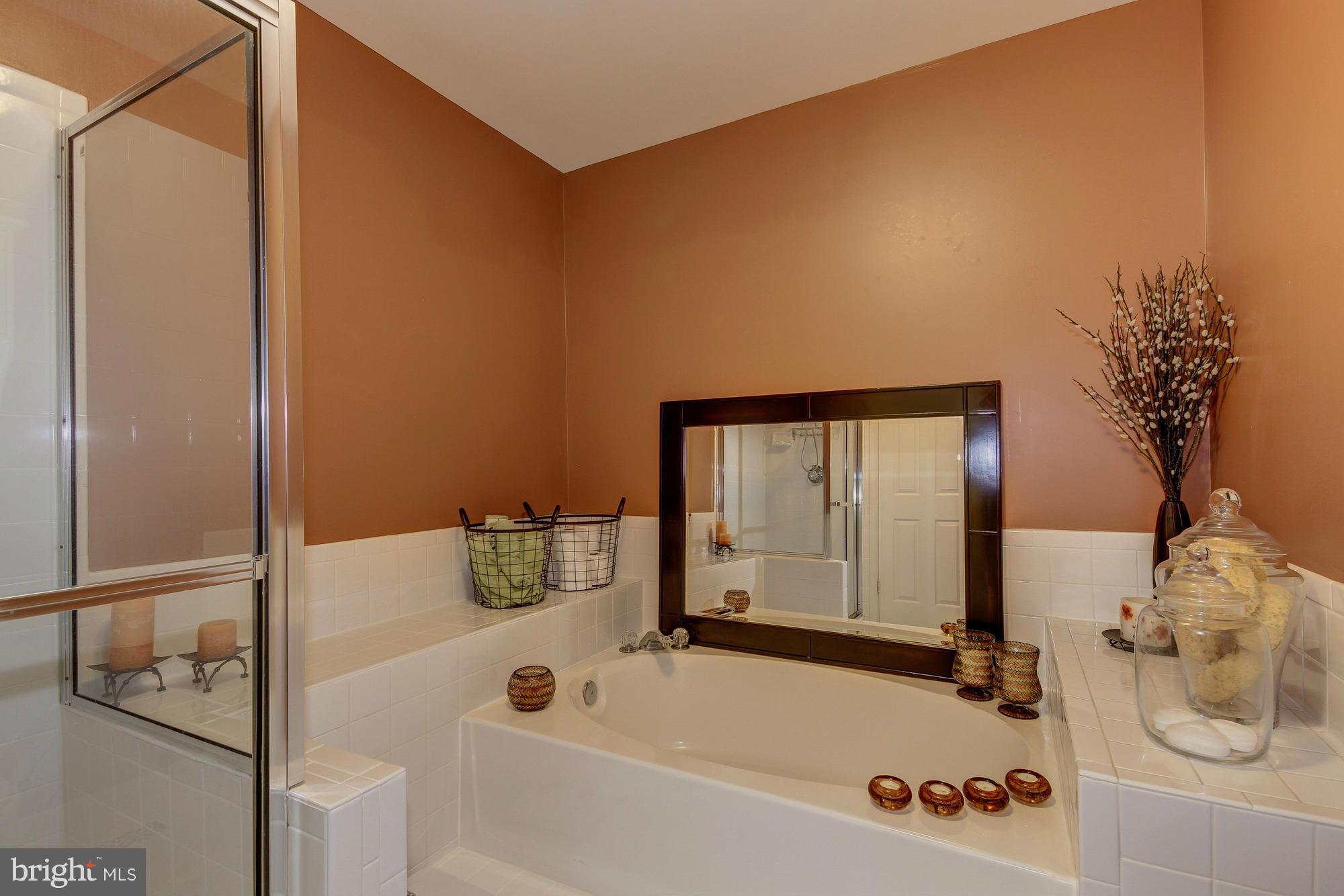 6162 Good Hunters Ride Columbia, MD 21045 - Photo 17 of 30 a bathroom with a tub and shower