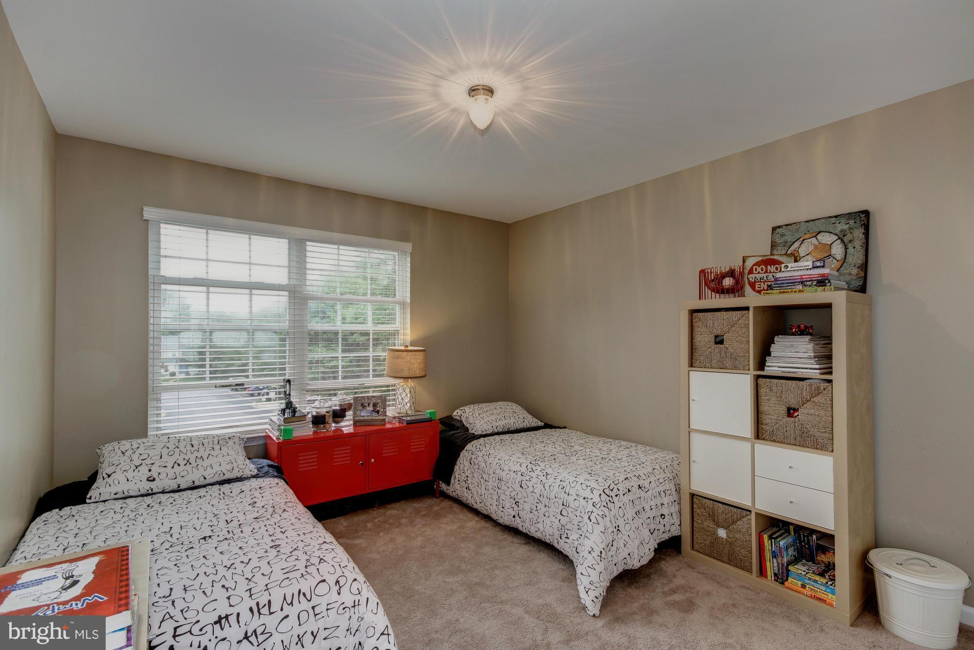 6162 Good Hunters Ride Columbia, MD 21045 - Photo 18 of 30 a bedroom with a bed and a window