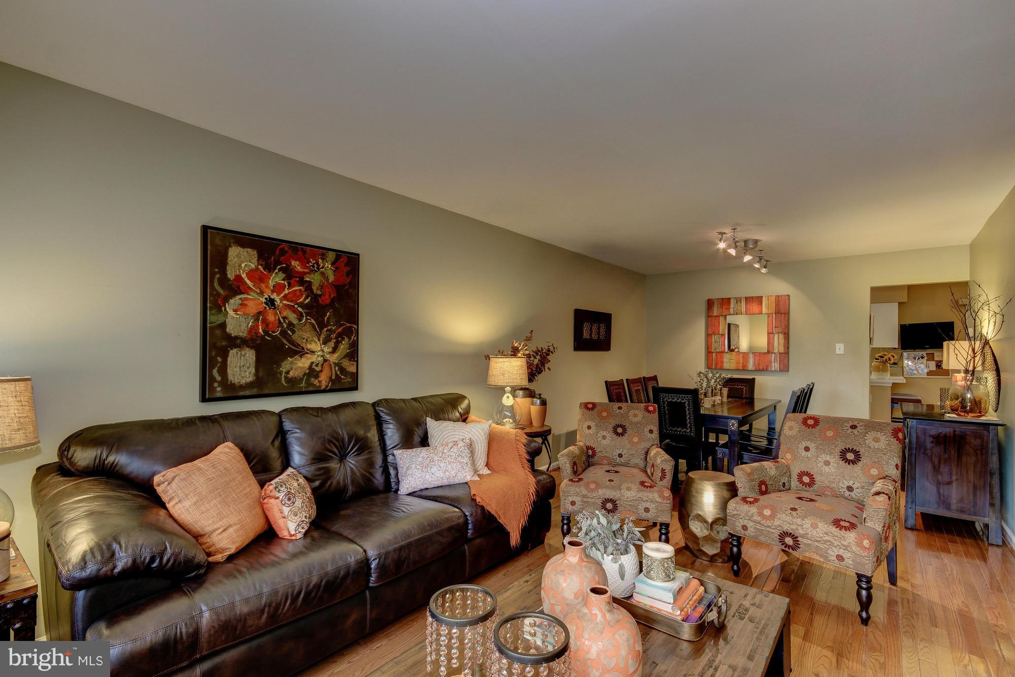 6162 Good Hunters Ride Columbia, MD 21045 - Photo 3 of 30 a living room with furniture kitchen view and a wooden floor