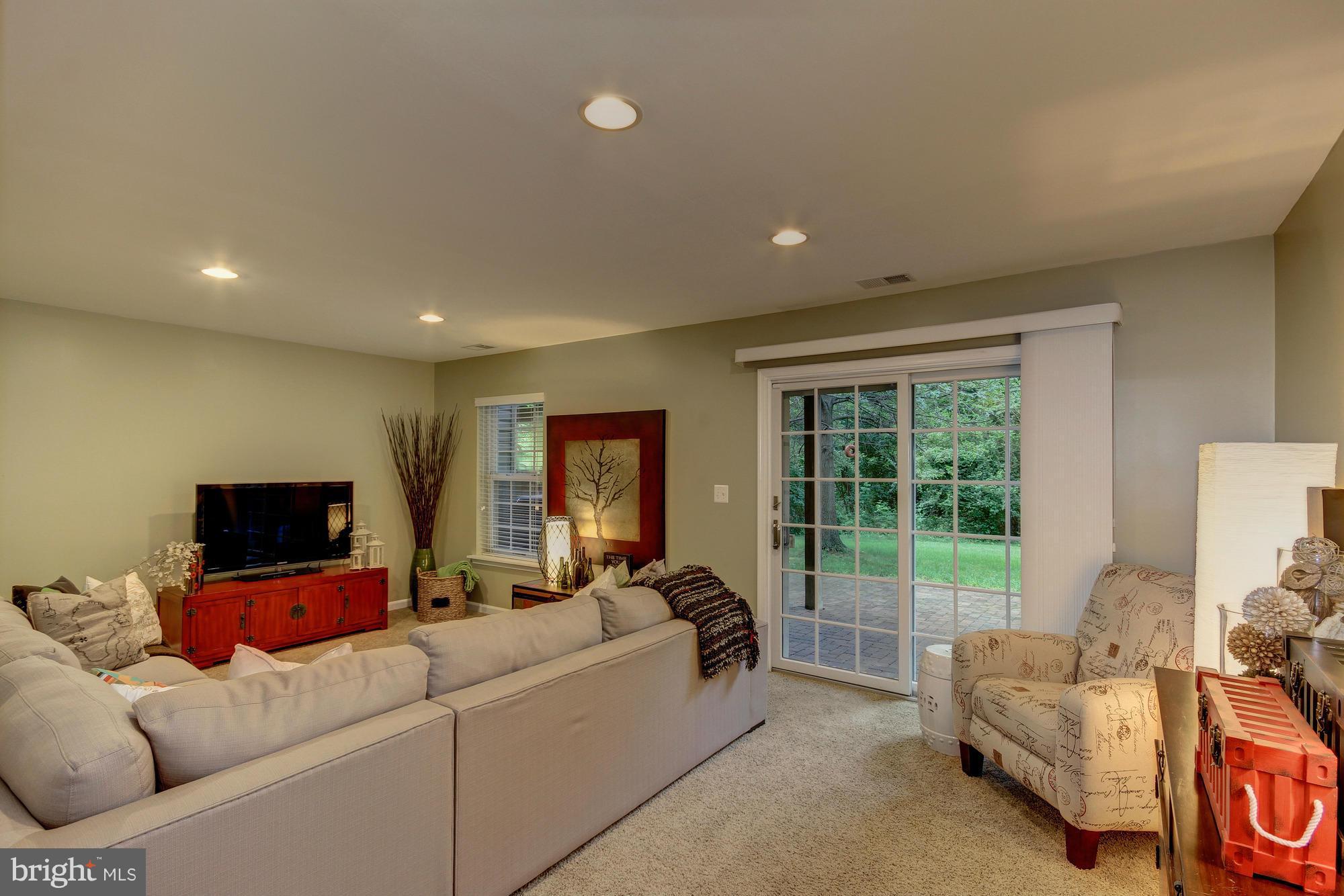 6162 Good Hunters Ride Columbia, MD 21045 - Photo 21 of 30 a living room with furniture and a flat screen tv