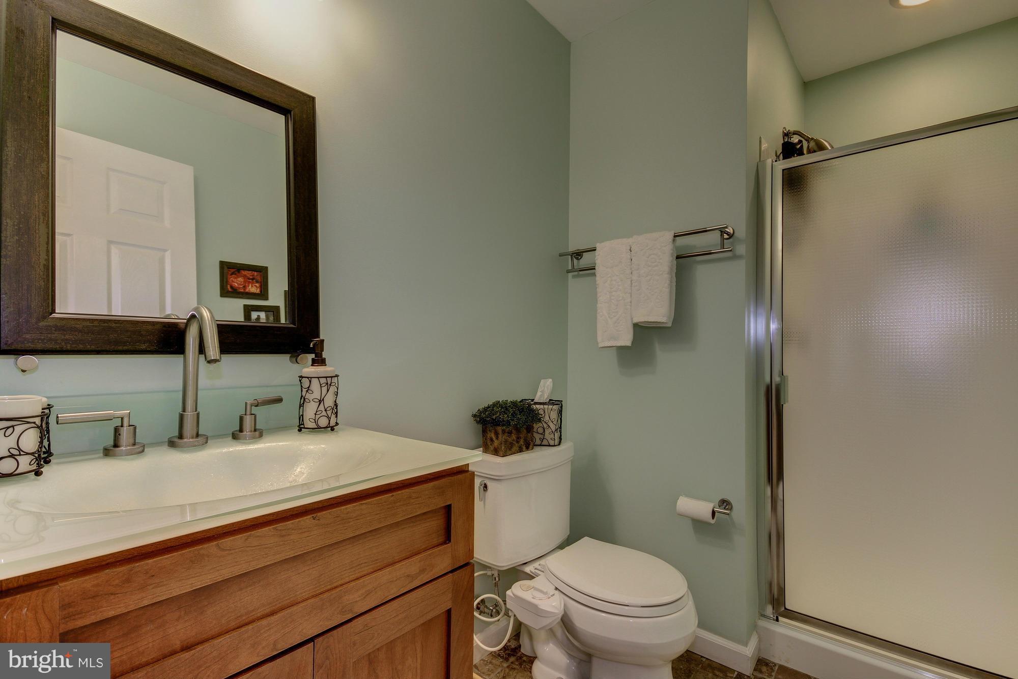 6162 Good Hunters Ride Columbia, MD 21045 - Photo 25 of 30 a bathroom with a granite countertop sink mirror vanity and toilet