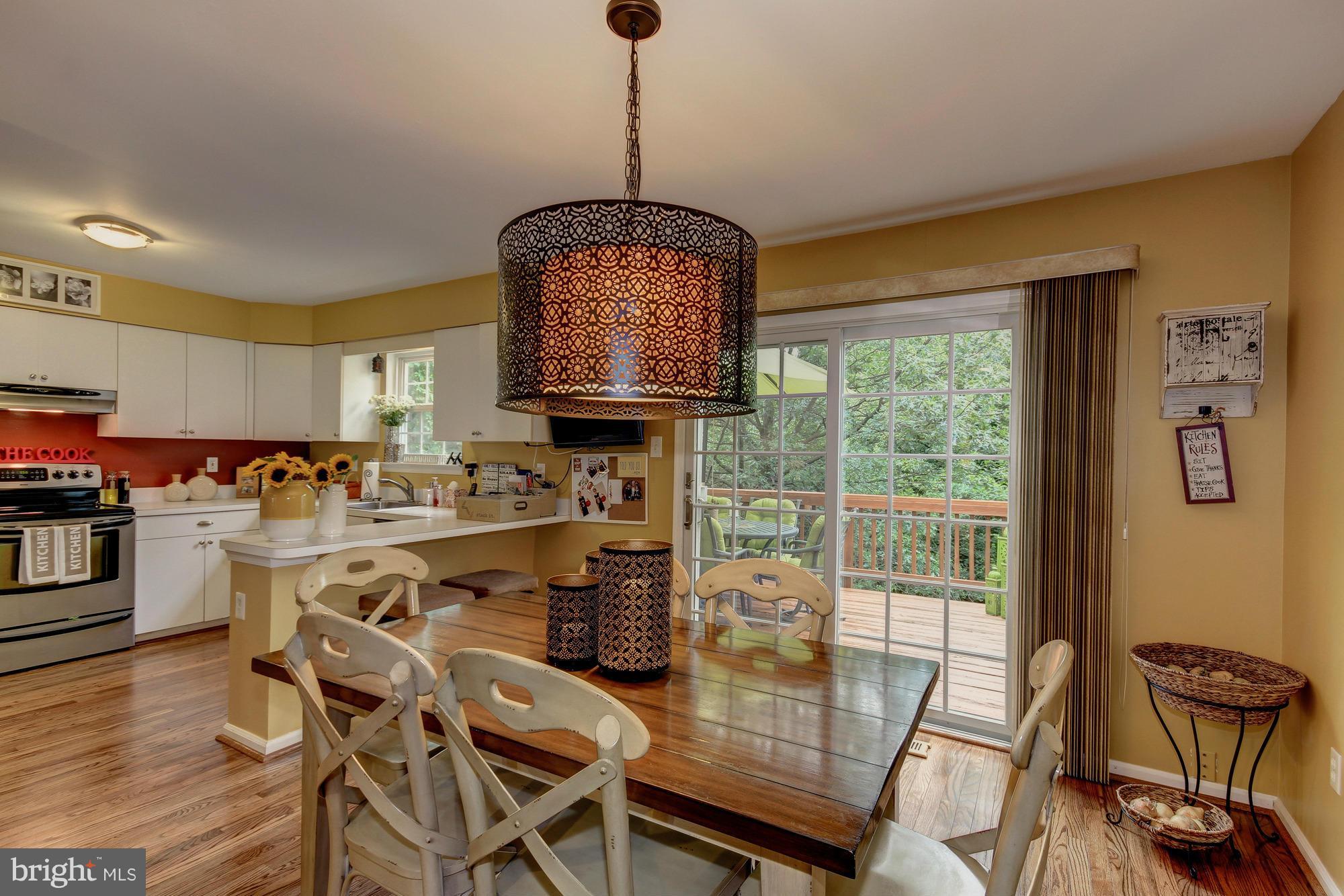 6162 Good Hunters Ride Columbia, MD 21045 - Photo 10 of 30 a view of a dining room with furniture window and outside view