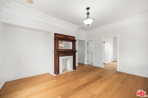 a bedroom with a bed and a tv