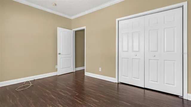 an empty room with wooden floor