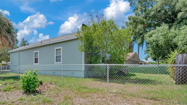 a backyard of a house with lots of green space