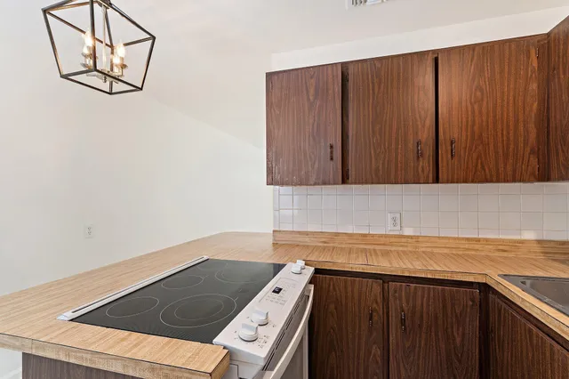 a view of a kitchen with wooden floor