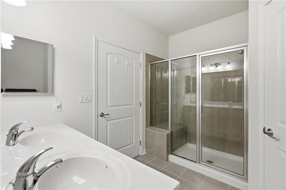 4120 Eveningstar Road Emmaus, PA 18049 - Photo 44 of 62 A well-appointed bathroom features a spacious shower enclosure and a double vanity.