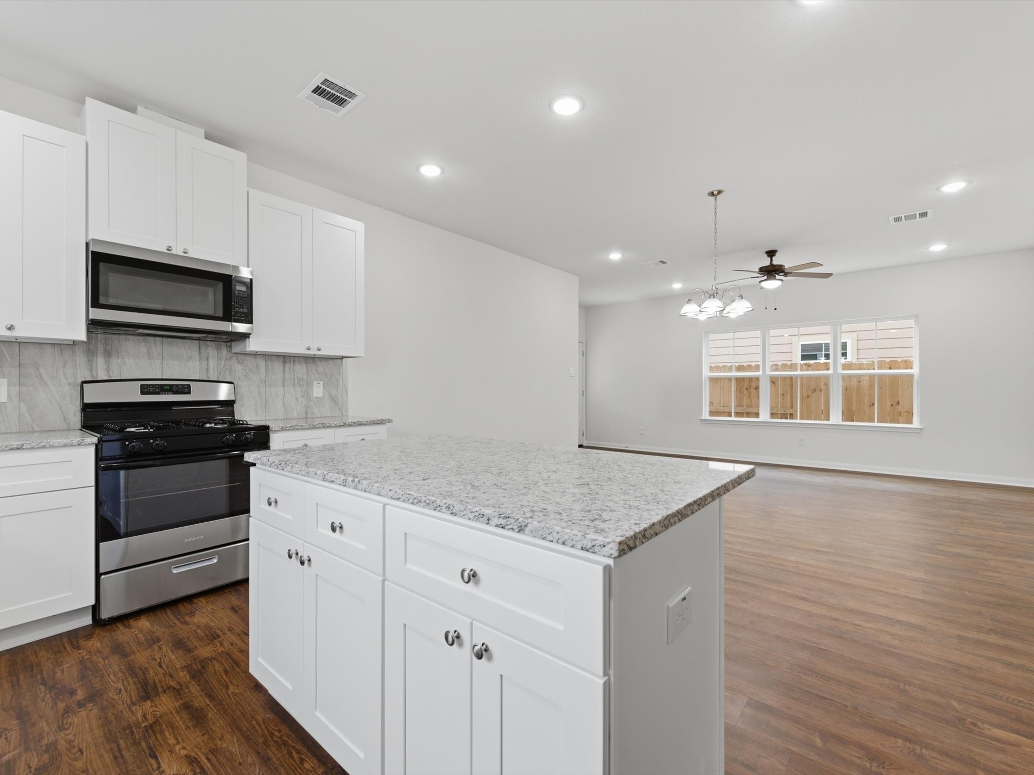 2803 Topiary Lane Houston, TX 77014 - Photo 15 of 31 The seamless flow from the kitchen to the living space keeps everyone connected and makes entertaining effortless.