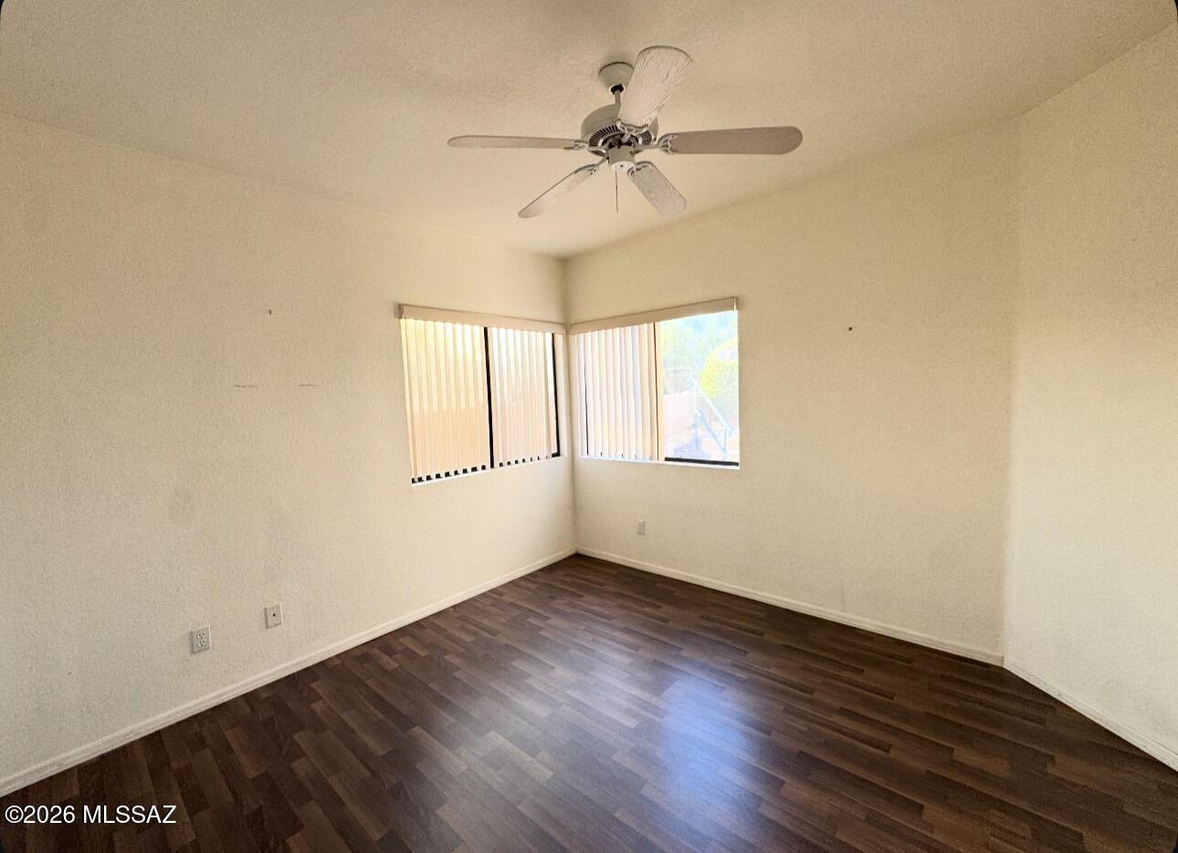 4998 North Valle Road Tucson, AZ 85750 - Photo 3 of 11 wooden floor in an empty room with a window