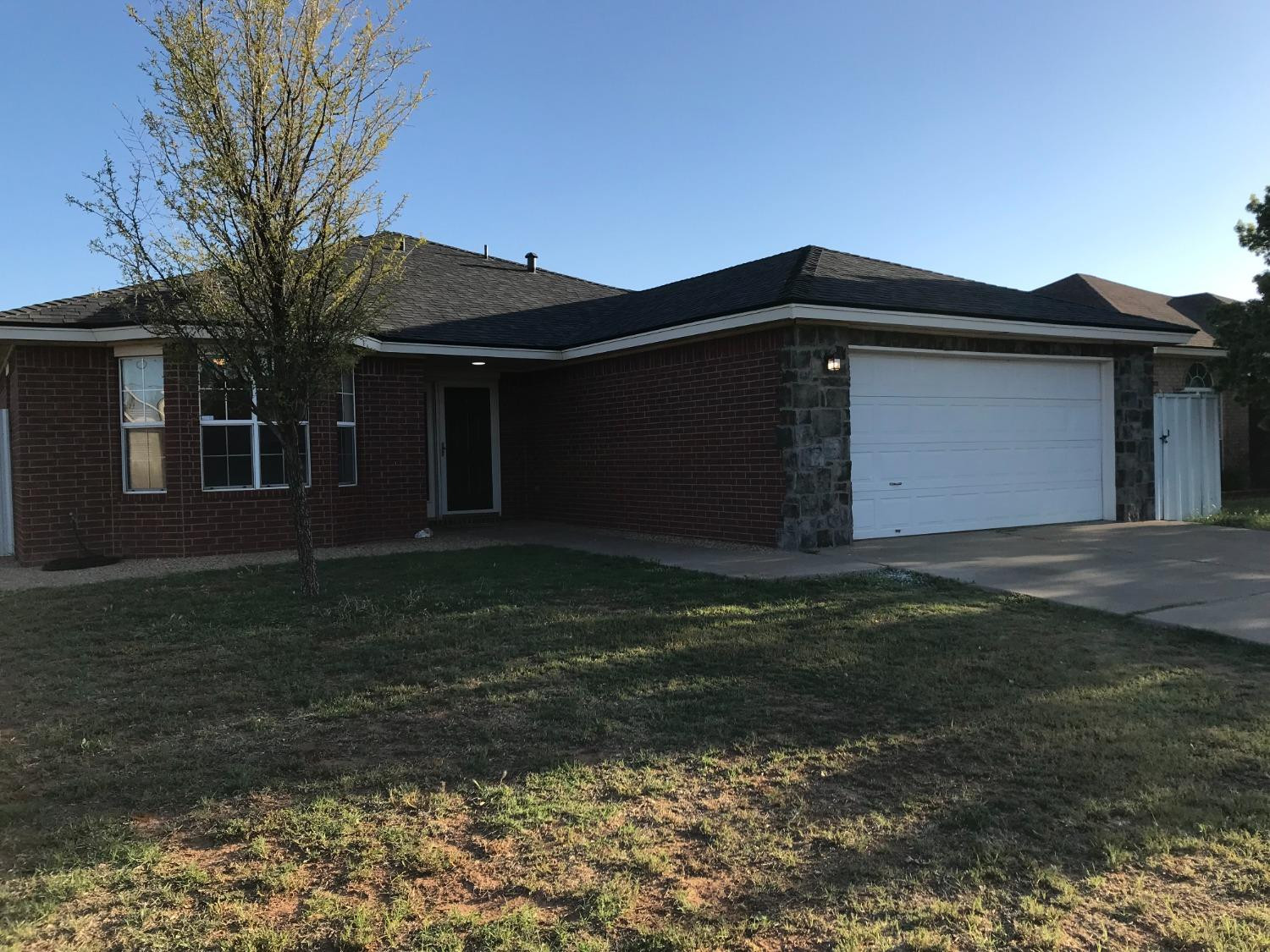 6201 5th Street Lubbock, TX 79416 - Photo 1 of 32 a front view of house with yard