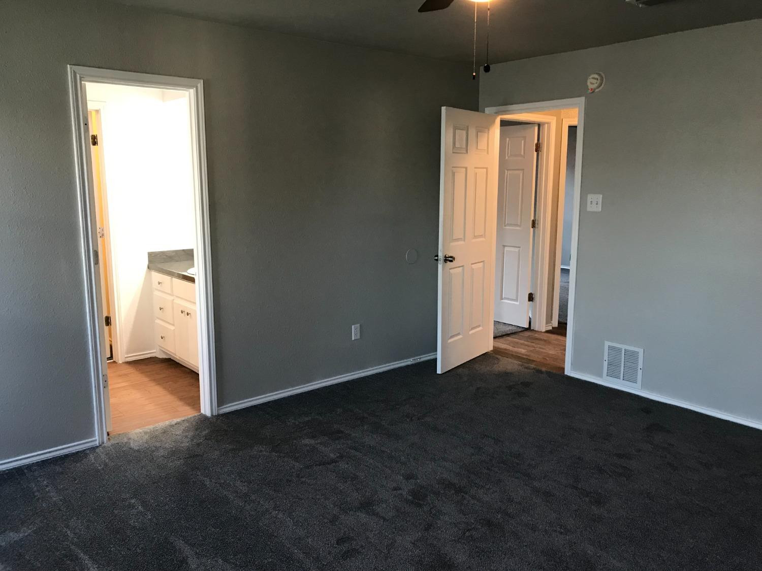 6201 5th Street Lubbock, TX 79416 - Photo 17 of 32 a view of an empty room with closet and a window