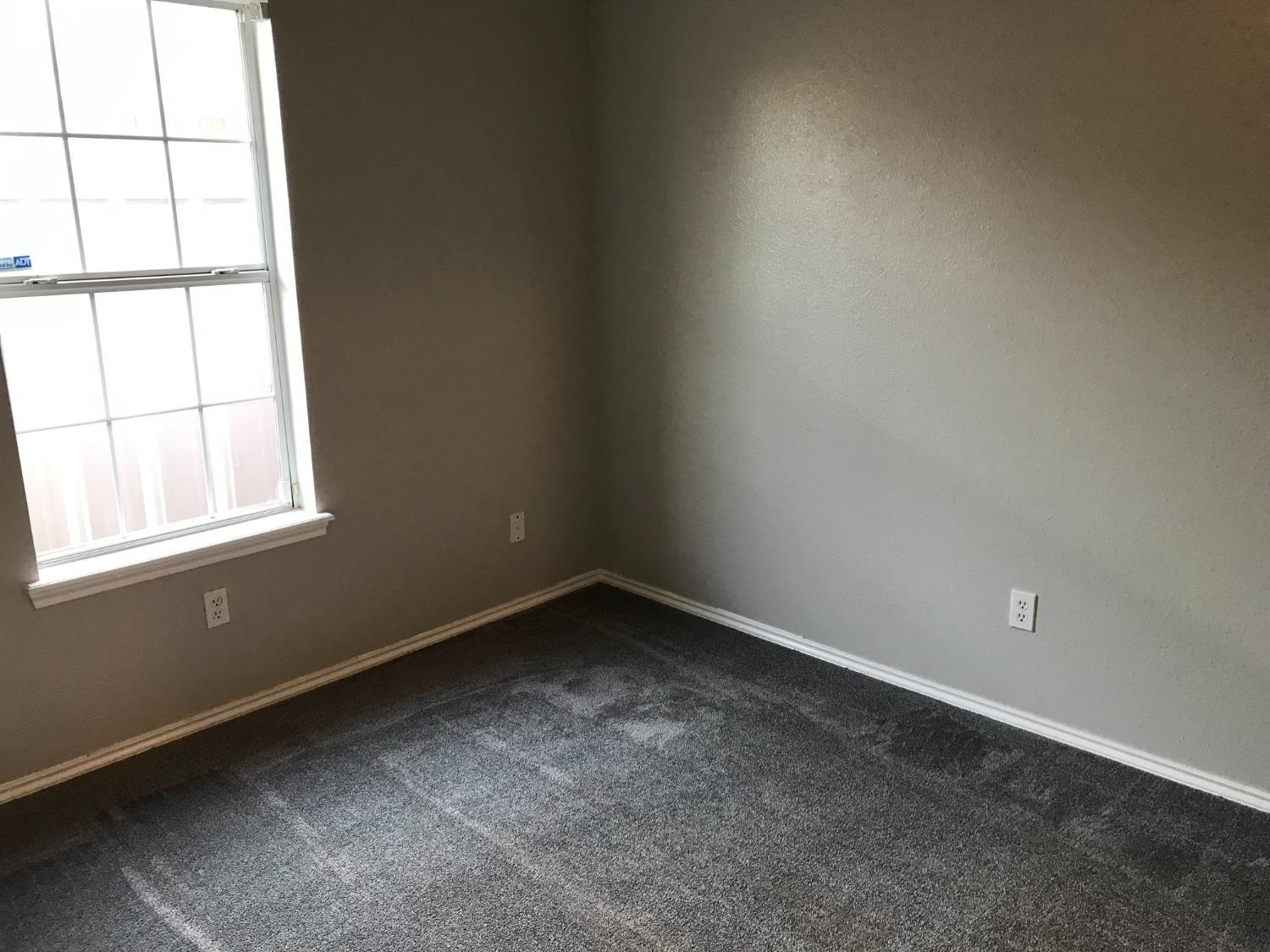 6201 5th Street Lubbock, TX 79416 - Photo 19 of 32 an empty room with a window